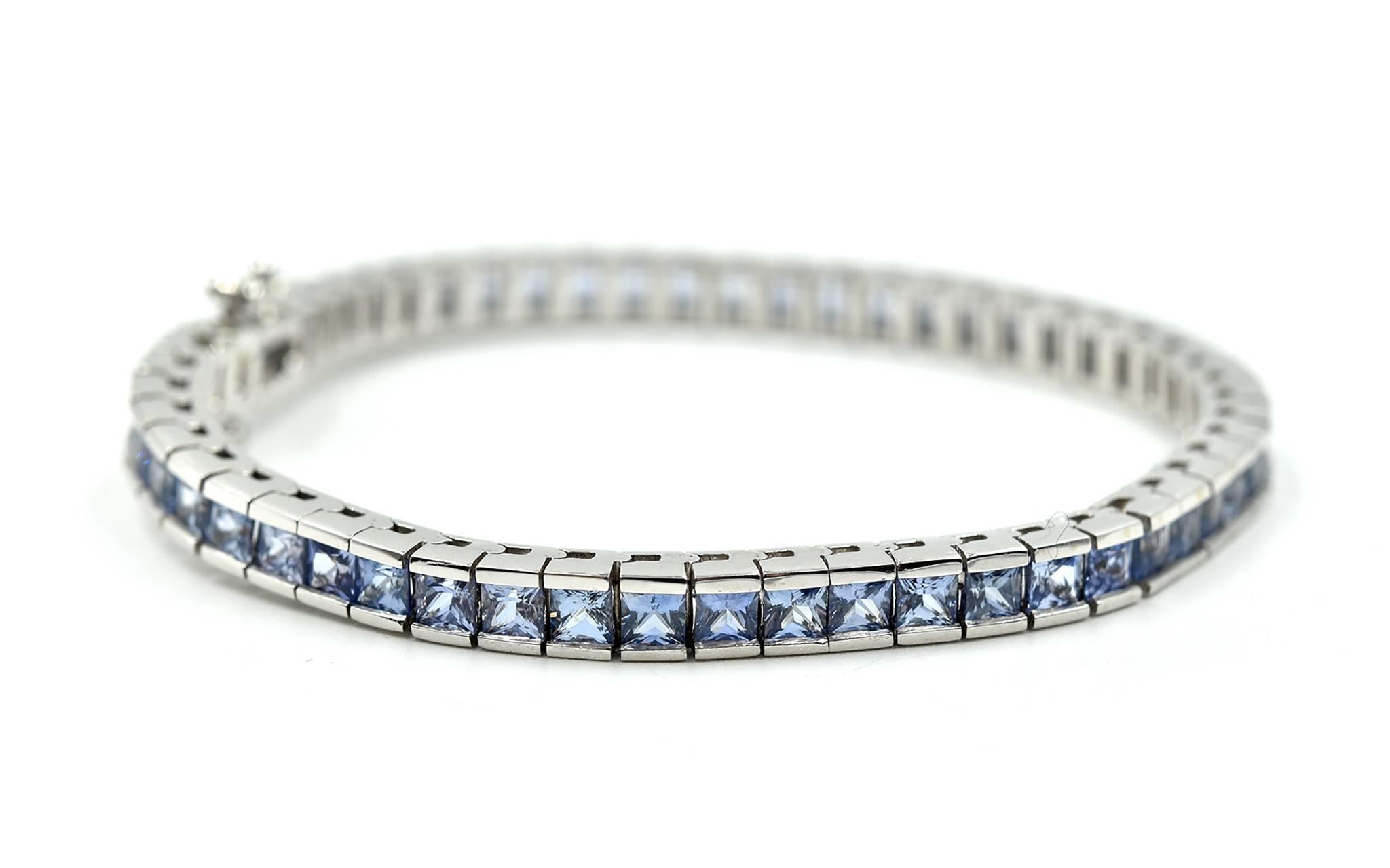 Designer: custom design
Material: 14k white gold
Blue Sapphires: 55 square cuts = 10.10 carat total weight
Dimensions: bracelet is 6 ¾ inches long and ¼ an inch wide
Weight: 21.60 grams
