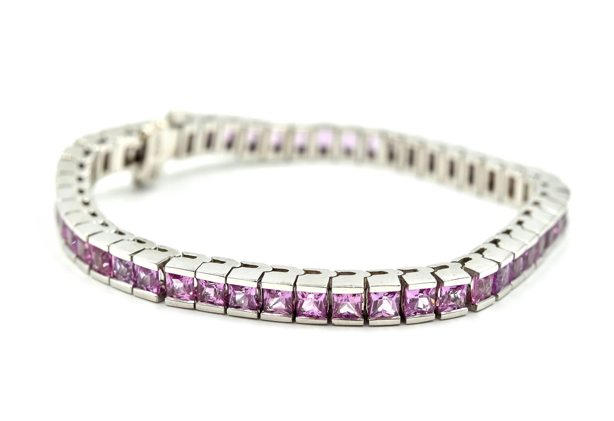 Designer: custom design
Material: 14k white gold
Pink Sapphires: 49 square cuts = 13.36 carat total weight
Dimensions: bracelet is 7 inches long
Weight: 28.20 grams
