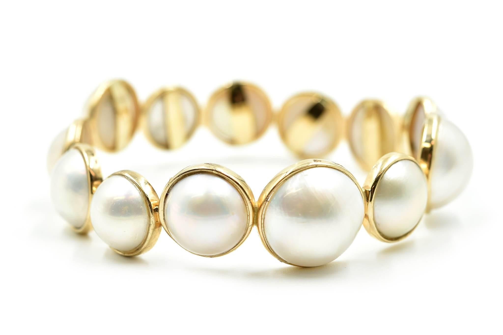 Designer: custom design
Material: 14k yellow gold
Pearls: pearls measure 13.14mm - 17.43mm in diameter
Dimensions: bracelet is 8 inches long and ¾ an inch wide
Weight: 45.70 grams
