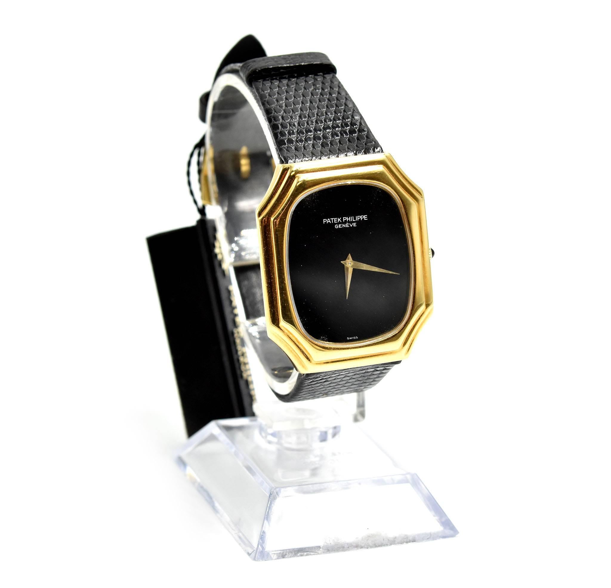 Movement: manual wind
Function: hours, minutes
Case: 18k yellow gold 31mm x 37mm rectangular case, sapphire protective crystal, pull/push crown
Band: black lizard band with gold buckle
Dial: onyx dial with gold hands
Serial #: 2764XXX
Reference #: