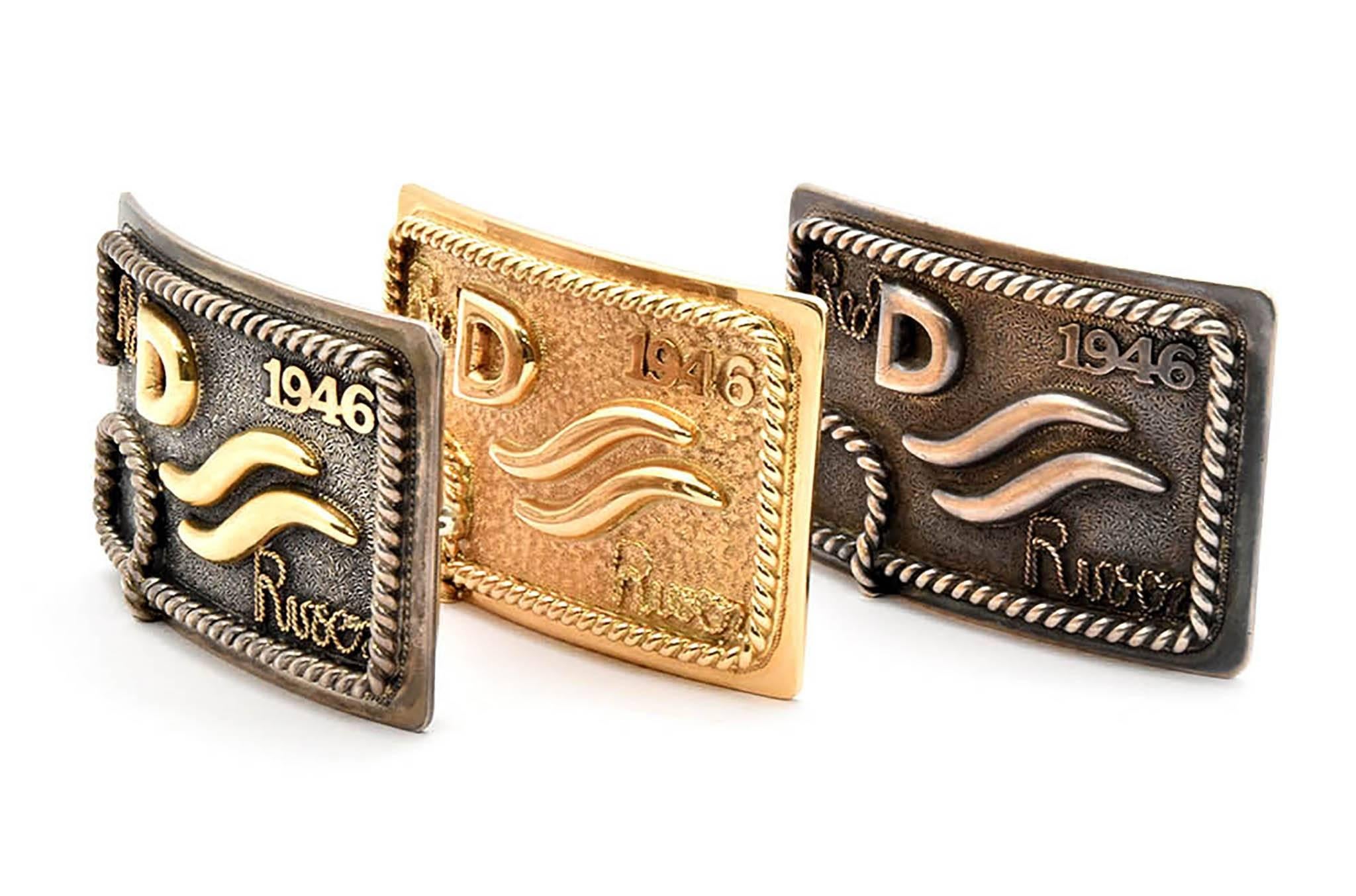 This collection of limited edition belt buckles by Edward H. Bohlin celebrate the 100th anniversary of the release of the film Red River featuring John Wayne. In the film, Wayne’s cattle brand is a D.

Each buckle is described below:

Solid 14k