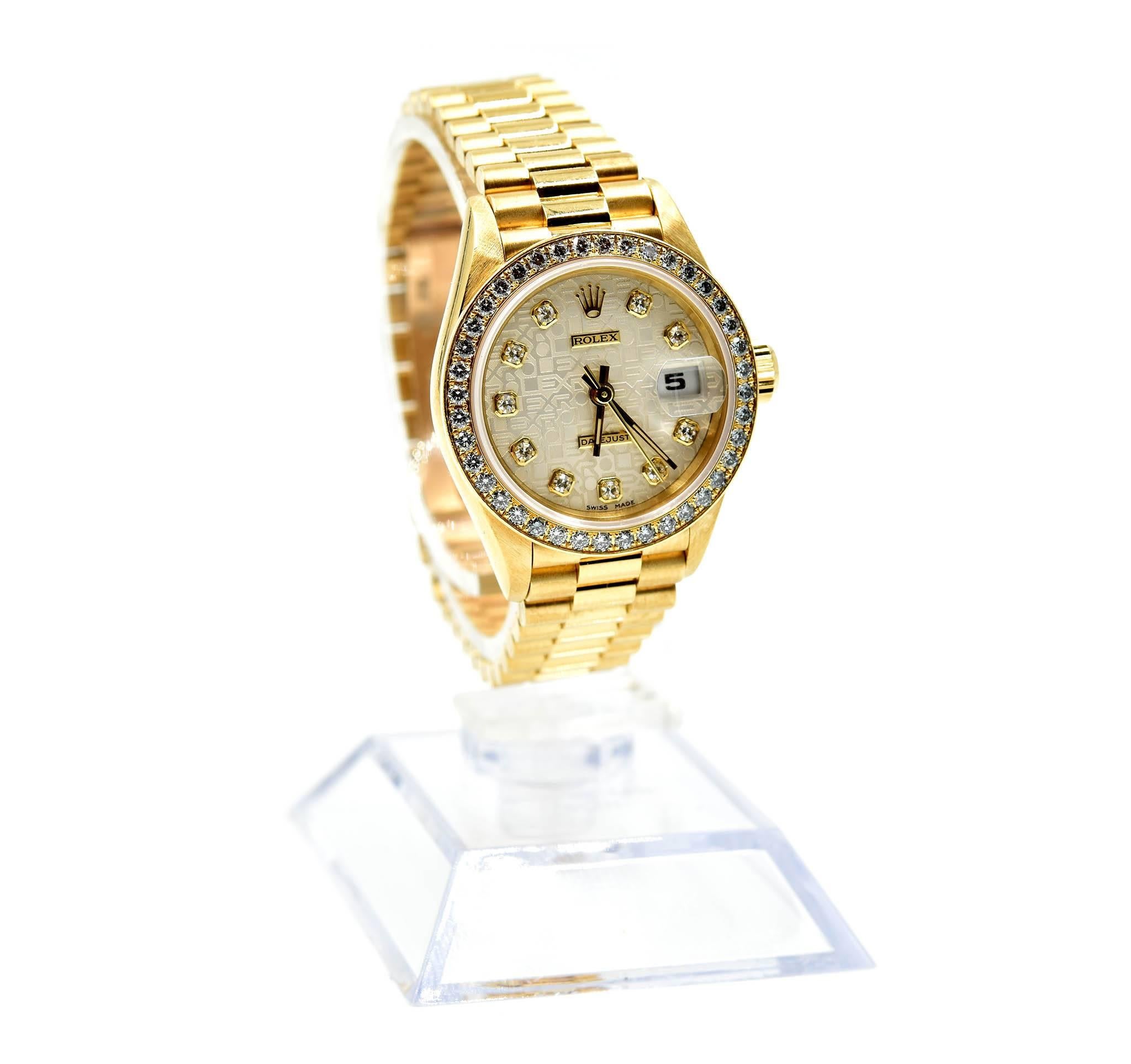 Movement: automatic
Function: hours, minutes, sweep seconds, date
Case: round 26mm 18k yellow gold case with factory diamond bezel, sapphire protective crystal, screw-down crown, water resistant to 30 meters 
Band: 18k yellow gold presidential