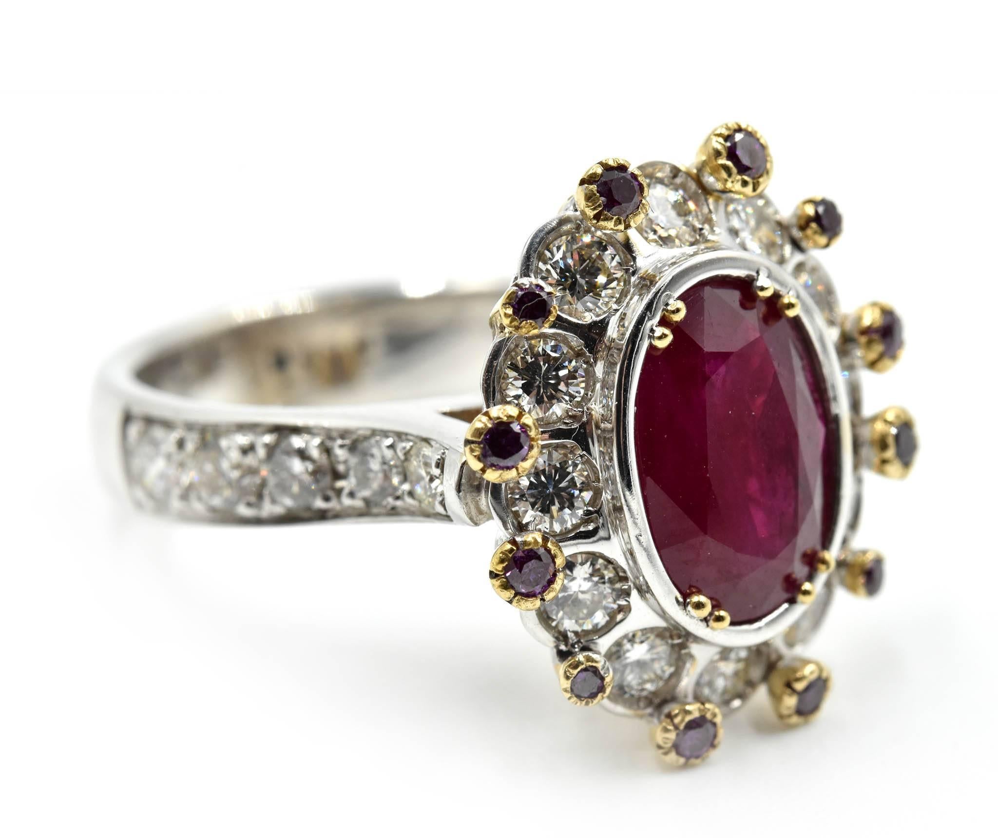 Rare and untreated, this all-natural 3.91ct Burma ruby is stunning in this 14k yellow and white gold setting! The oval cut ruby is surrounded by a round brilliant white diamond halo. Total weight of the white diamonds is 1.44 carats. There are 12