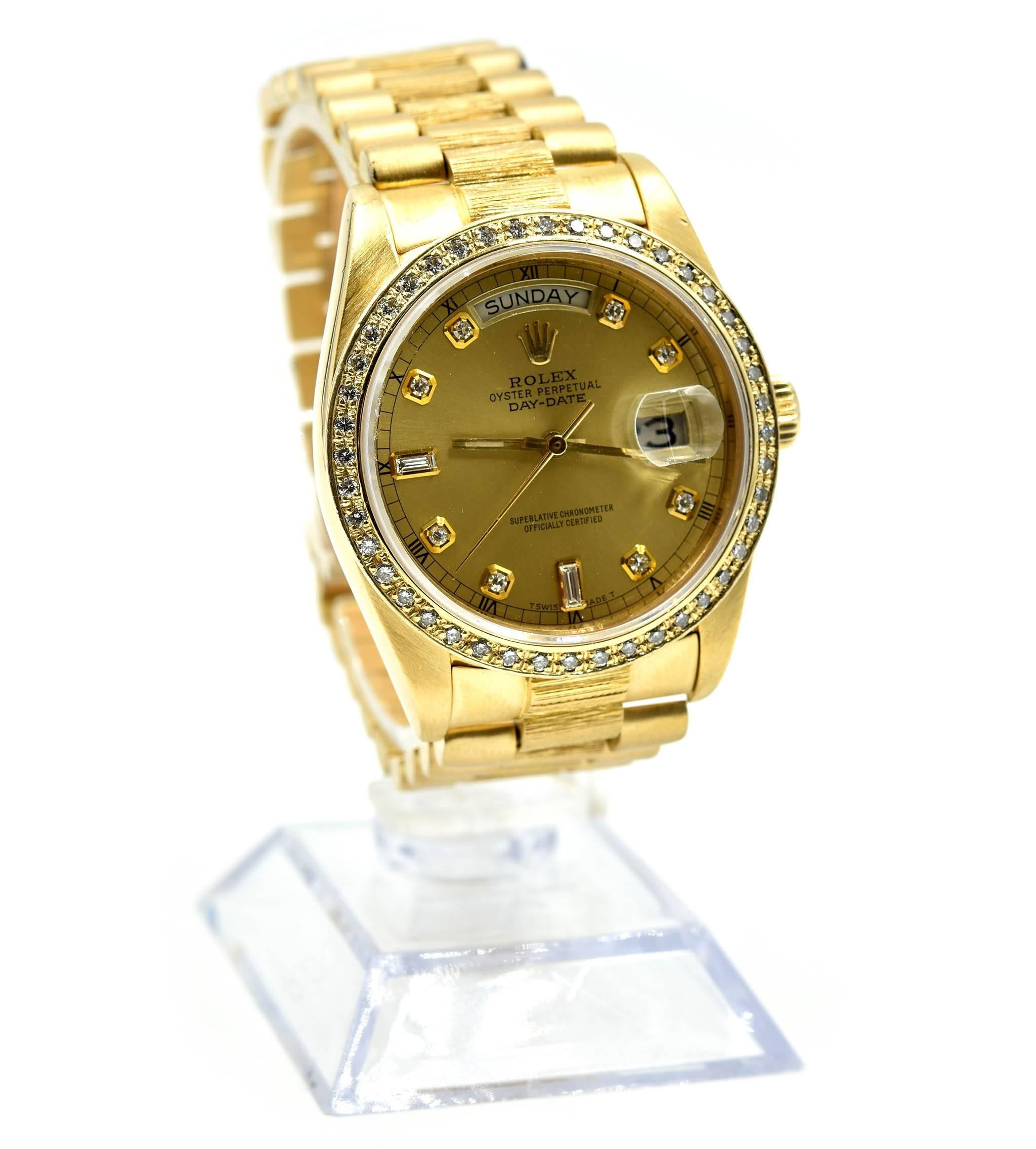 Movement: automatic
Function: hours, minutes, seconds, date
Case: round 36mm 18k yellow gold case, custom diamond bezel, scratch resistant sapphire crystal, screw down crown, water resistant to 100 meters
Band: 18k yellow gold bark finish bracelet