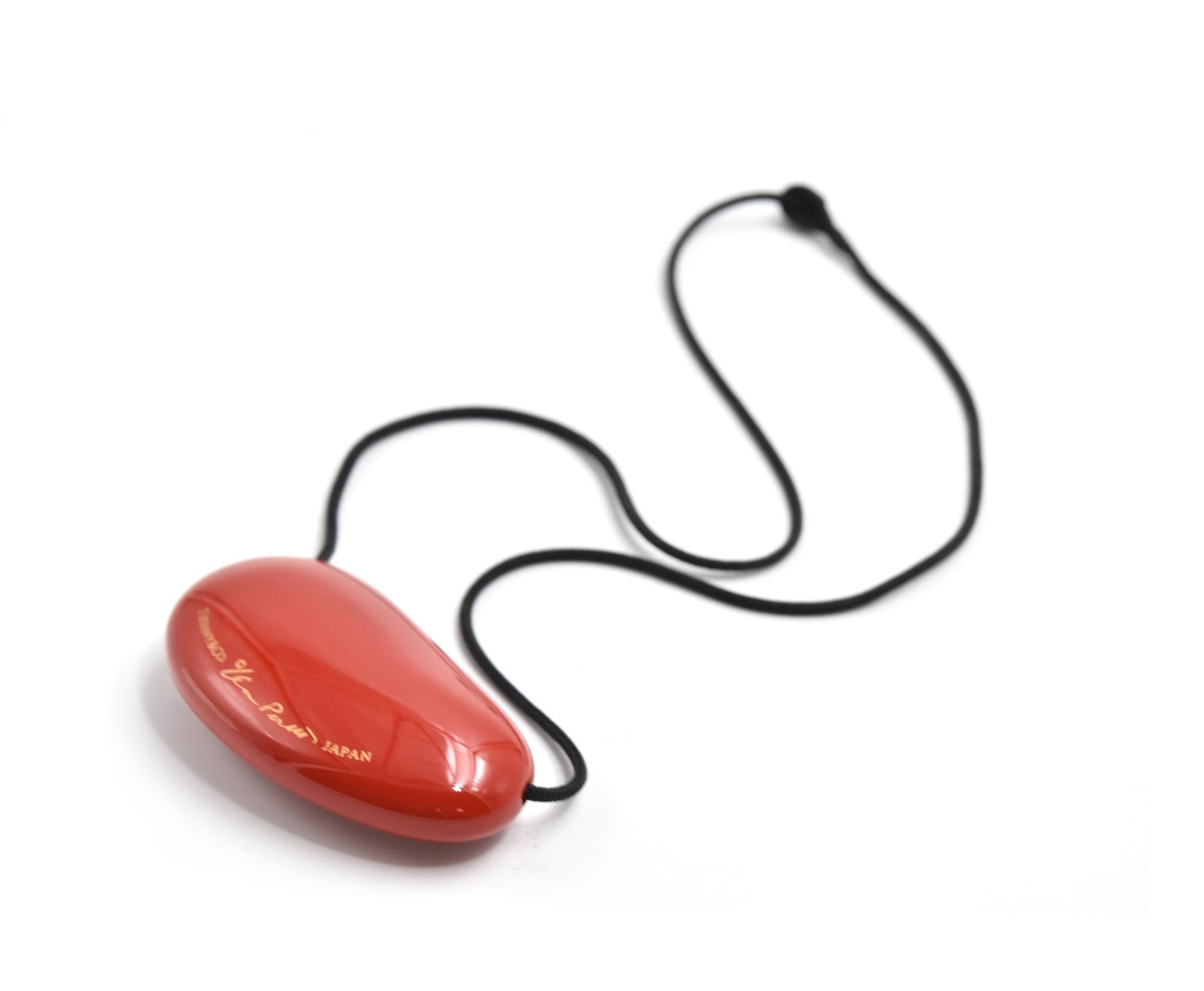 Designer: Tiffany & Co
Hallmarks: T & CO
Material: red lacquer over Japanese hardwood
Dimensions: necklace is 18-inch long, pendant is 1 3/4-inch long and 1-inch wide
Weight: 6.98 grams
Retail: $265
