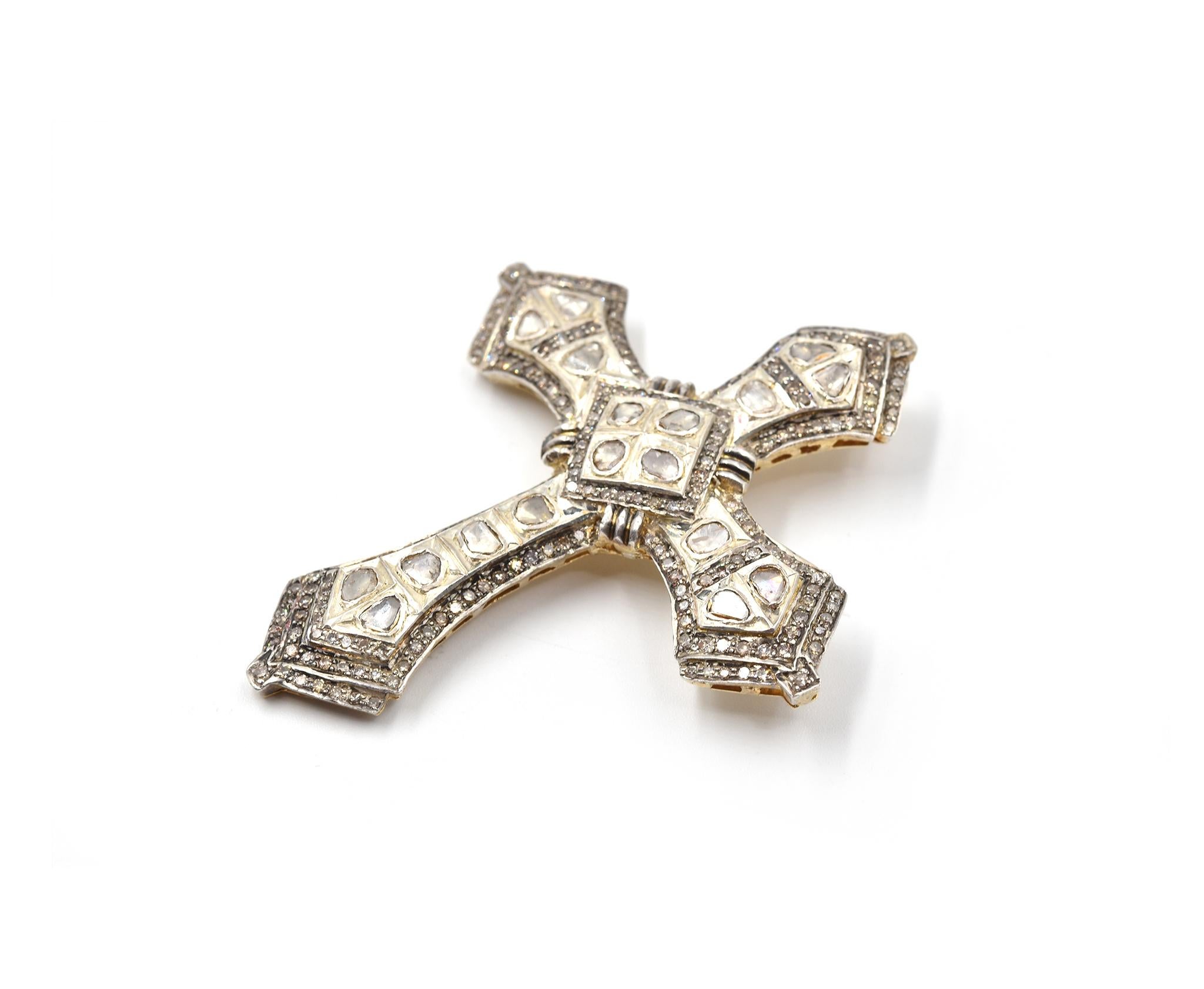 Designer: custom design
Material: silver/gold plated on the back of cross 
Diamonds: 208 rose cut diamonds = 3.90cttw
Color: G/H
Clarity: SI
Dimensions: pendant is 2.60-inch long and 2.21-inch wide
Weight: 21.34 grams
