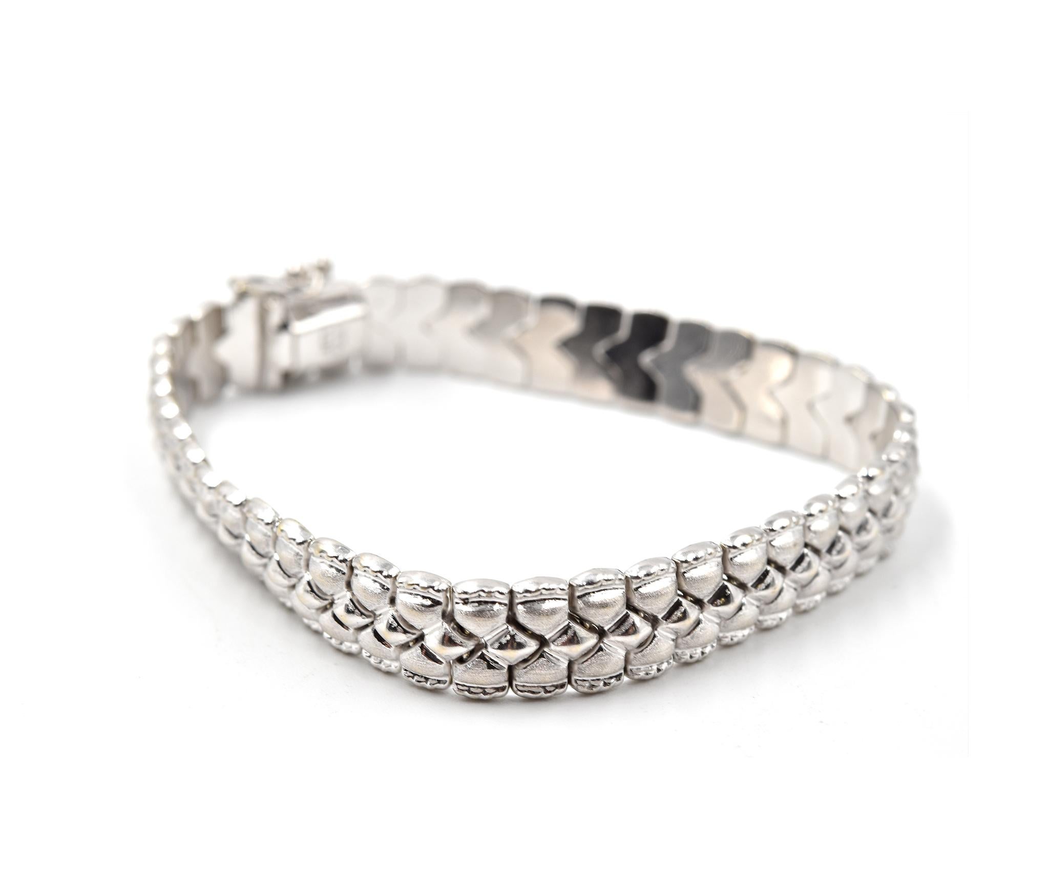 Designer: custom design
Material: 14k white gold
Dimensions: bracelet is 7-inch long and 9mm wide 
Weight: 12.80 grams
