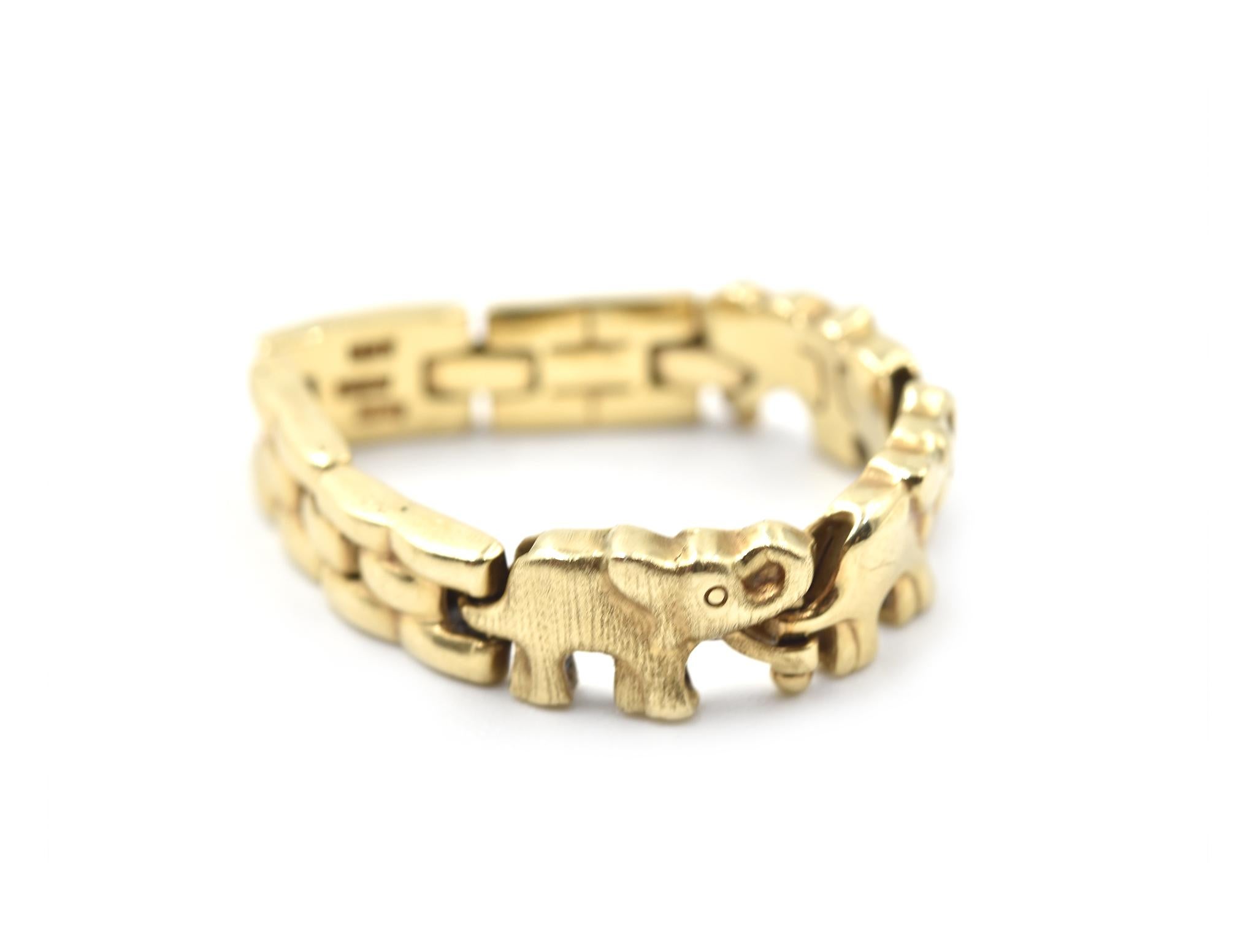 Designer: custom design
Material: 14k yellow gold
Ring size: 7 
Dimensions: ring is 5.50mm wide 
Weight: 3.12 grams 
