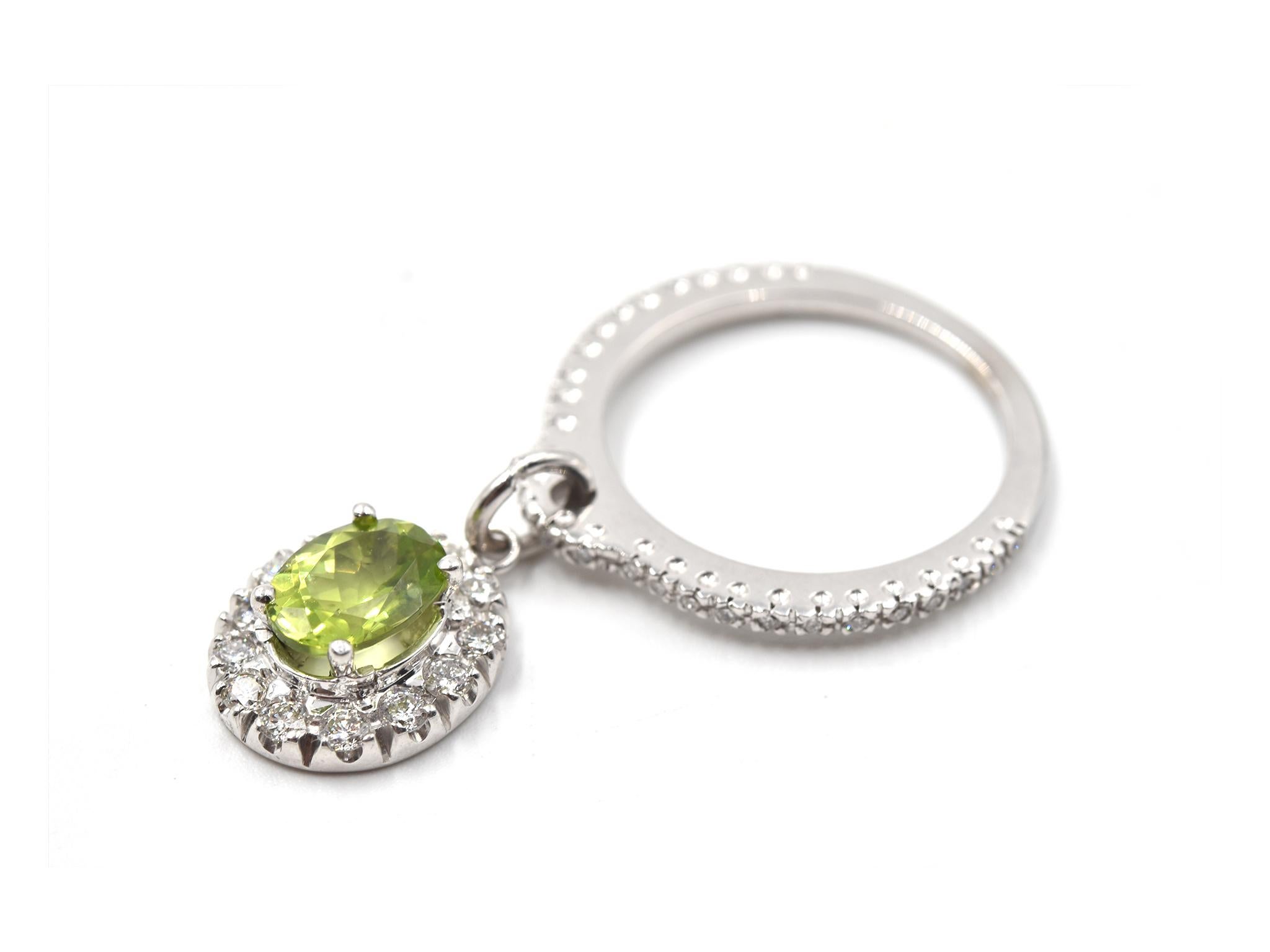 Designer: custom design
Material: 14k white gold
Peridot: 1 oval cut = 1.39ct, prong set in halo
Diamonds: 42 round brilliant cut = 0.50cttw
Color: G
Clarity: VS
Ring Size: 7 ¼ (please allow two additional shipping days for sizing