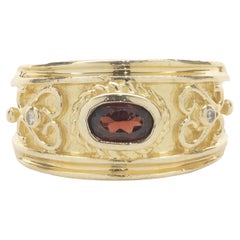 14 Karat Yellow Gold Bezel Set Garnet and Diamond Scroll Ring