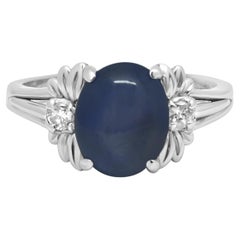 14K White Gold Oval Cabochon Cut Blue Star Sapphire and Round Diamond Ring