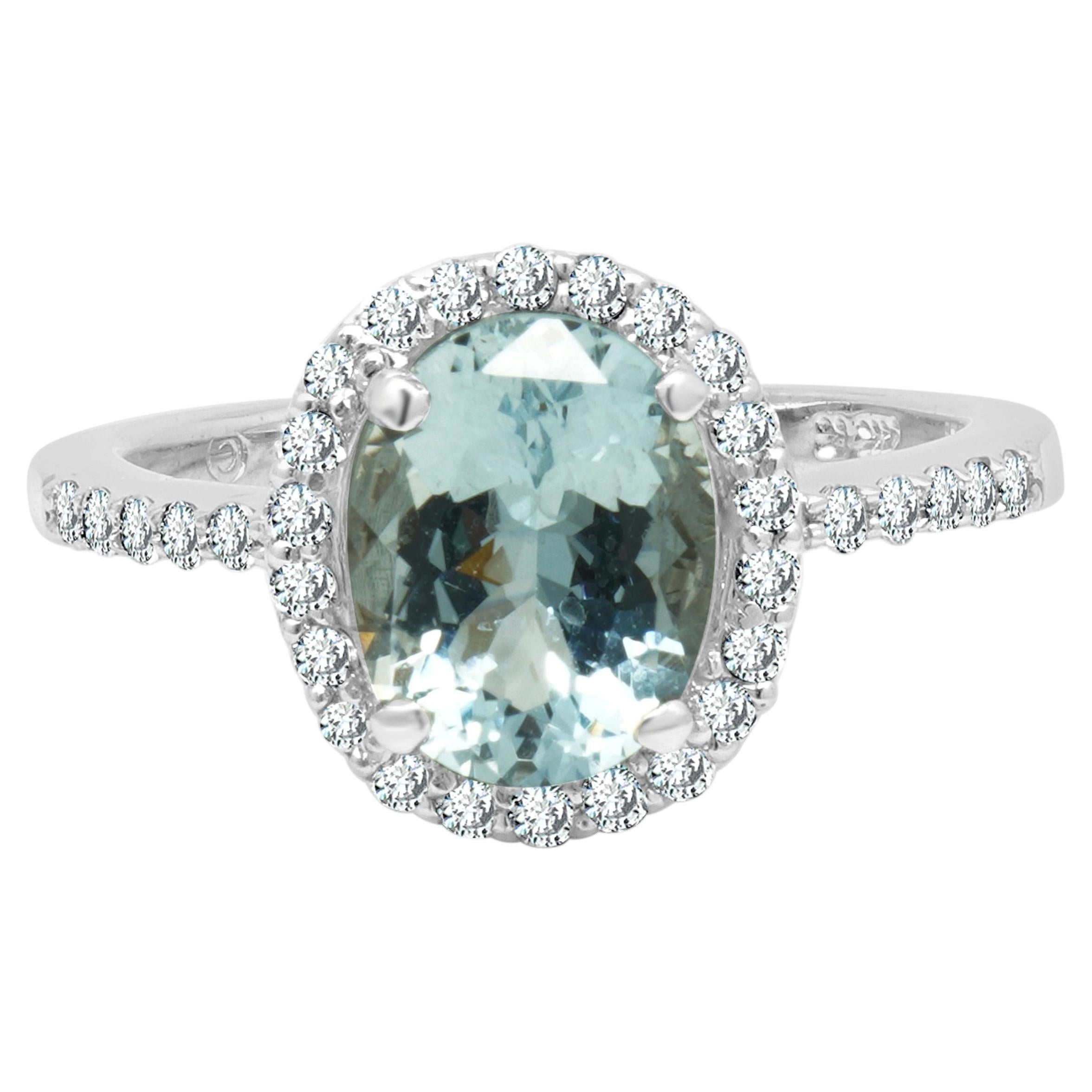 Anello in oro bianco 14 carati con acquamarina taglio ovale e diamanti rotondi a corona