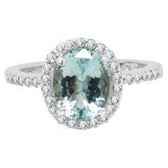 14K White Gold Oval Cut Aquamarine and Round Diamond Halo Ring