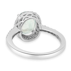 14K White Gold Oval Cut Aquamarine and Round Diamond Halo Ring