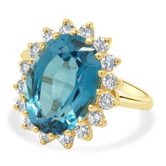 14K Yellow Gold Oval Cut Blue Topaz and Round Diamond Halo Ring