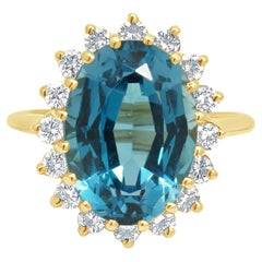 14K Yellow Gold Oval Cut Blue Topaz and Round Diamond Halo Ring