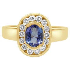 14K Yellow Gold Oval Cut Tanzanite and Round Diamond Halo Ring