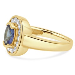 14K Yellow Gold Oval Cut Tanzanite and Round Diamond Halo Ring