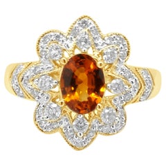 14K Yellow Gold Oval Cut Spessartine Garnet and Round Diamond Flower Ring