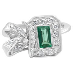 Platinum Emerald Cut Emerald and Diamond Halo Bow Ring