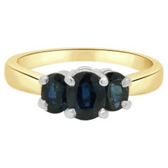 14K Two-Tone Yellow and White Gold Oval Cut Blue Sapphire 3-Stone Ring