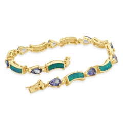 14K Yellow Gold Pear Cut Tanzanite, Opal Inlay, and Round Diamond Bracelet 7.5"