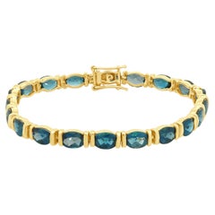 Bracciale a filo in oro giallo 14K con topazio blu taglio ovale sfaccettato, 7,0"