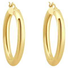 Pendientes de aro redondos huecos de oro amarillo de 14K