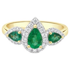 14 Karat Yellow Gold 3-Stone Pear-Shaped Emerald and Round Diamond Halo Ring