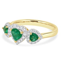 14 Karat Yellow Gold 3-Stone Emerald and Diamond Halo Ring