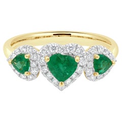 14 Karat Yellow Gold 3-Stone Emerald and Diamond Halo Ring