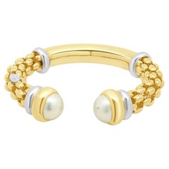 Bracciale a cuffia Fope in oro bicolore 18 carati (giallo e bianco) con terminali a perla Mabe