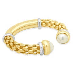 Bracciale a cuffia Fope in oro bicolore 18 carati (giallo e bianco) con terminali a perla Mabe