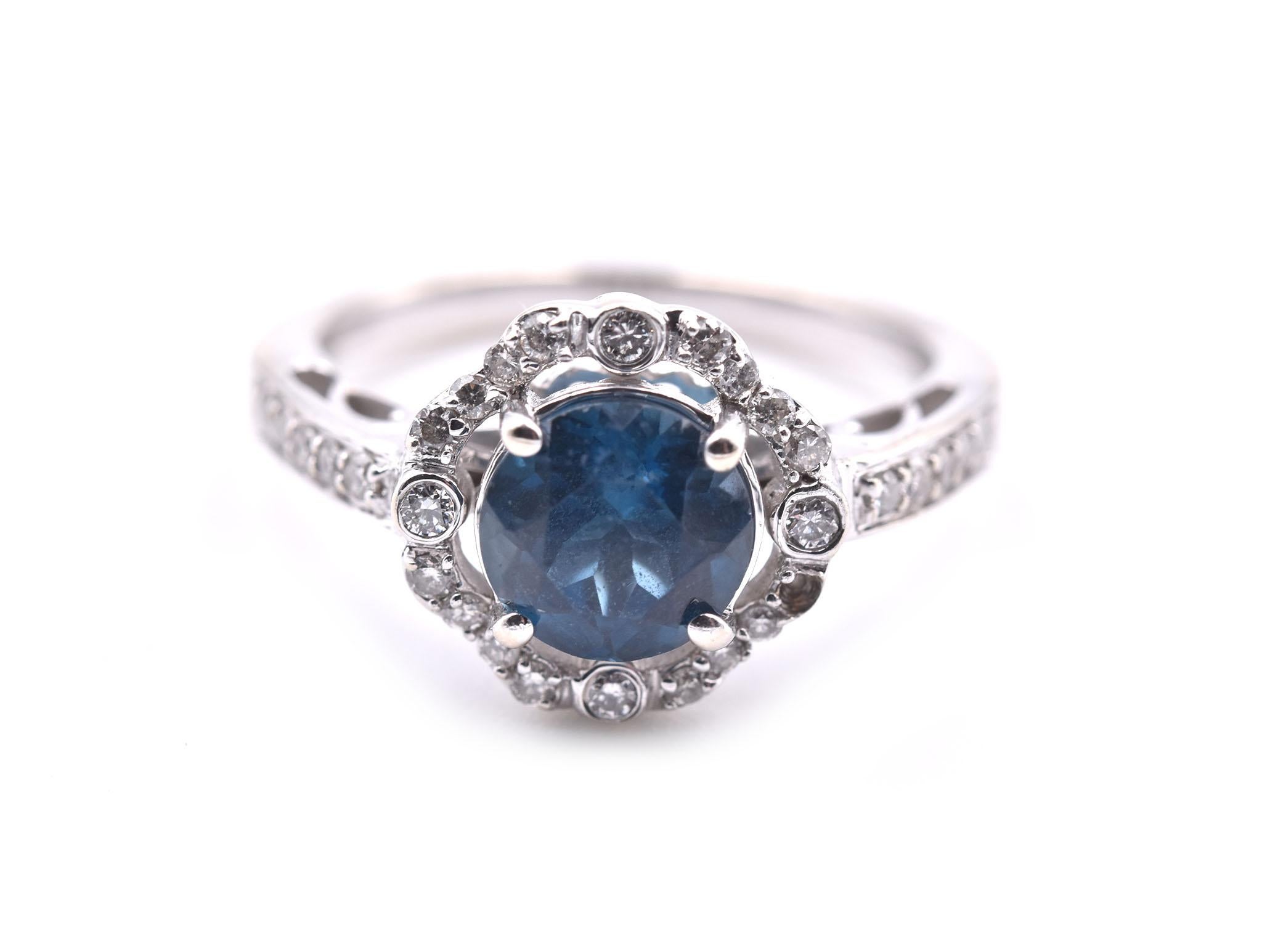 Designer: custom design
Material: 14k white gold 
London Blue Topaz: 1 round faceted cut= 1.50ct
Diamonds: round brilliant cut= .21cttw
Color: G	
Clarity: VS
Ring Size: 6 ¾ (please allow two additional shipping days for sizing requests)
Dimensions: