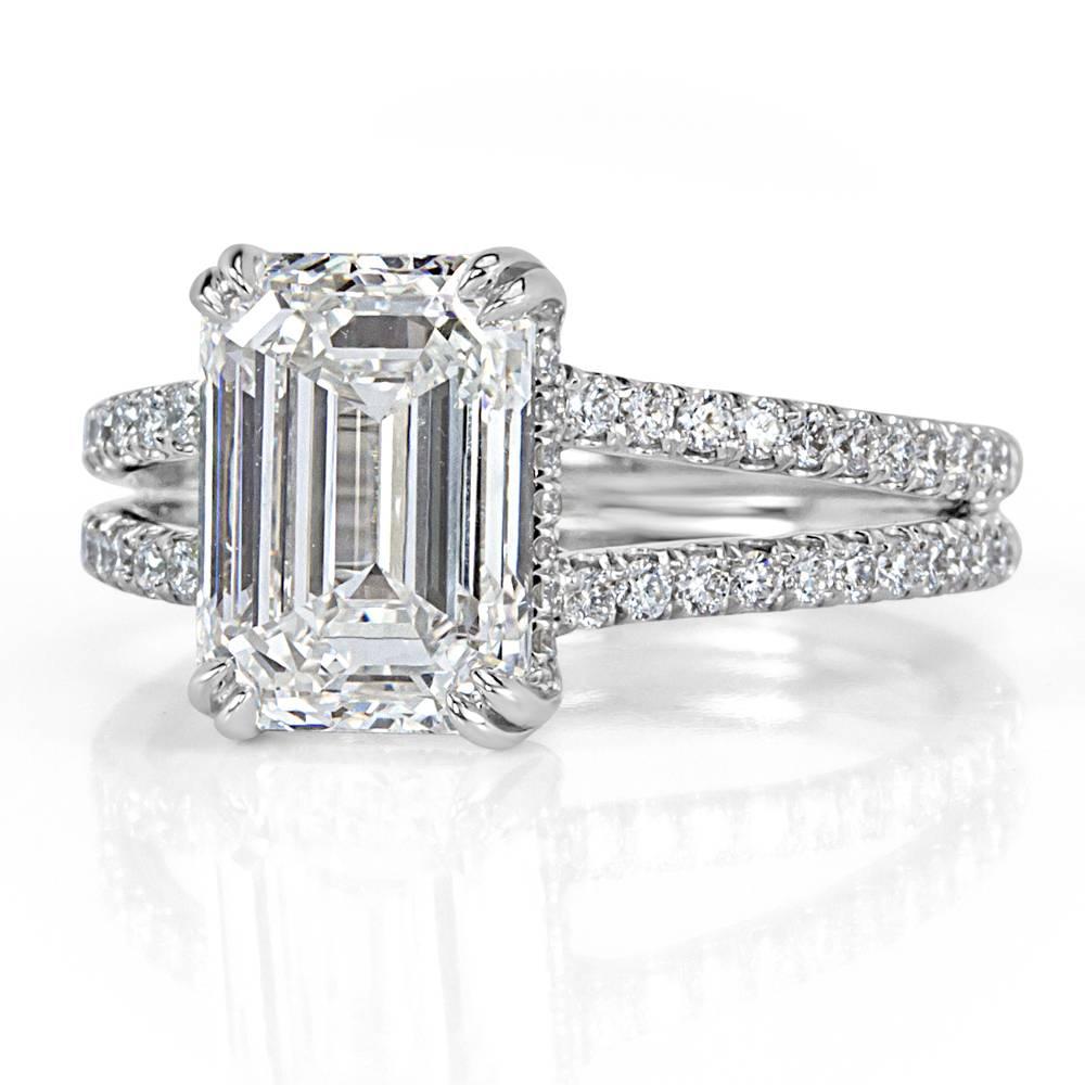 This timeless and outstanding piece features an incredible 3.50ct emerald cut diamond, GIA certified at H-VS1. Poised atop a delicate split shank adorned with micro pavé set round diamonds, this emerald cut diamond is the star of the show. The