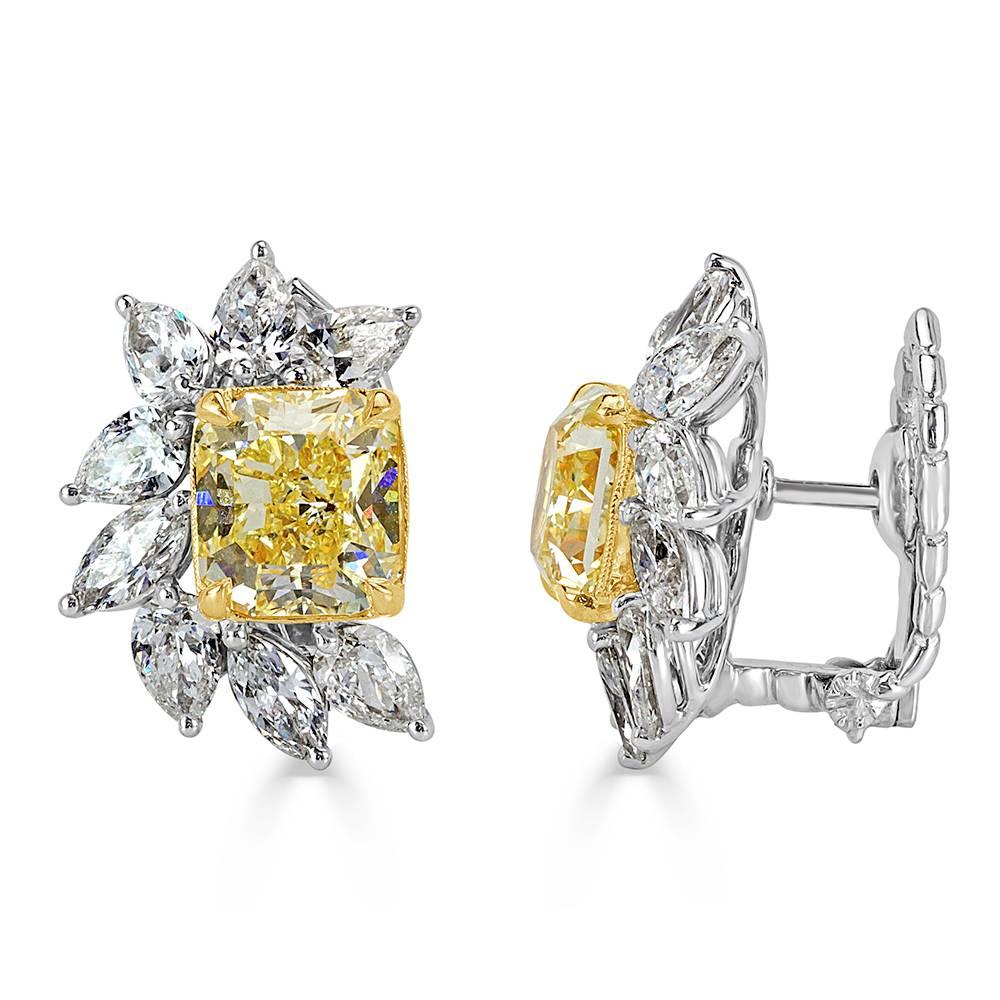 This truly stunning pair of diamond earrings showcases two gorgeous radiant cut diamonds with a total weight of 5.62ct. They are each GIA certified at fancy yellow-VS1 and accented by 3.22ct of marquise cut diamonds graded at E-F, VS1-VS2.
