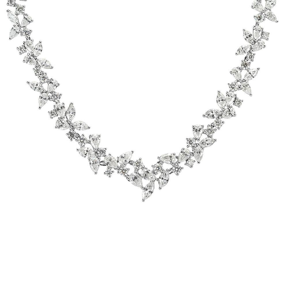 This stunning diamond necklace features a 17.75ct mosaic of pear shaped, marquise and round brilliant cut diamonds graded at E-F, VS1-VS2. All of the diamonds are exquisitely matched and hand set in 18k white gold.
