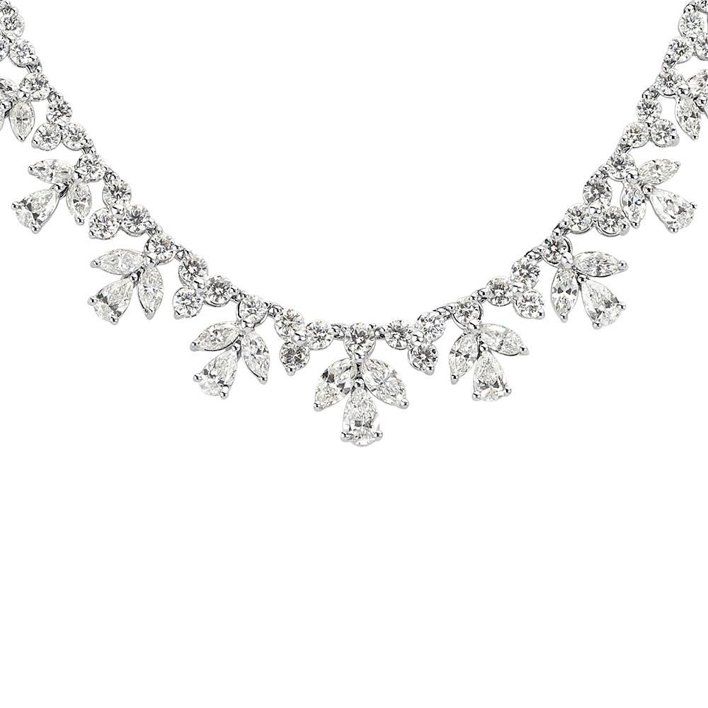 This stunning diamond necklace is handcrafted with 14.15ct of pear shaped, marquise, and round brilliant cut diamonds graded at E-F, VS1-VS2. All of the diamonds are exquisitely matched and hand set in 18k white gold.