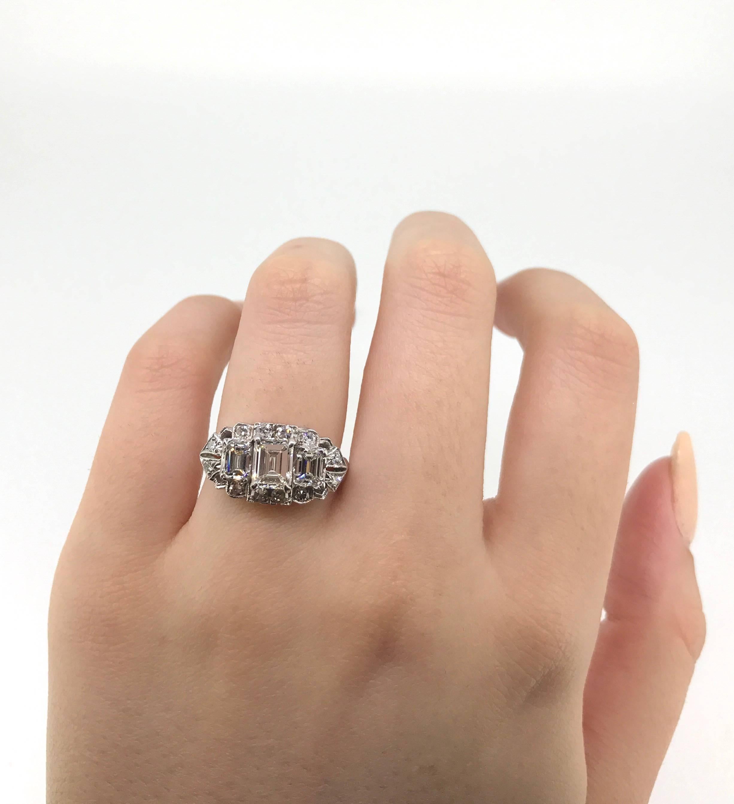 Women's Art Deco Platinum Three Emerald Cut Diamond and Twelve Single Cut Diamond Ring For Sale