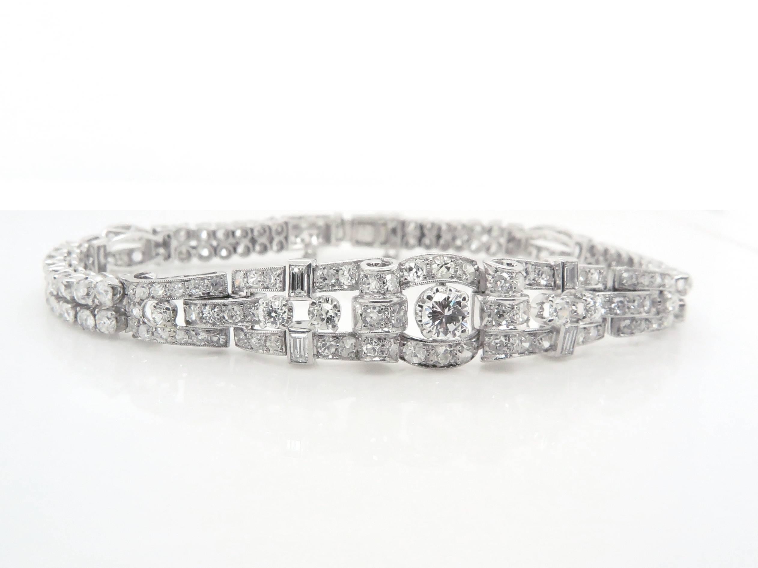 The bracelet is centred with a brilliant cut diamond, flanked by six old-fashioned cut Diamond and grain set with baguette cut diamonds. 

Estimated Total weight of the Diamonds - 5.45 Carats
Total weight of the bracelet - 25.6 grams

