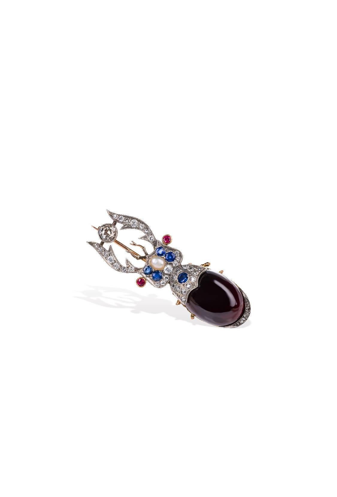 Carl Faberge Scarab Brooch with Diamonds, sapphires and Rubies.
These Pin is Signed and Stamped with the gold mark 56 and the St Petersburg Mark which was in use up to the year 1899, the crosses anchors and sceptre.
Is Stamped also with Faberge’s