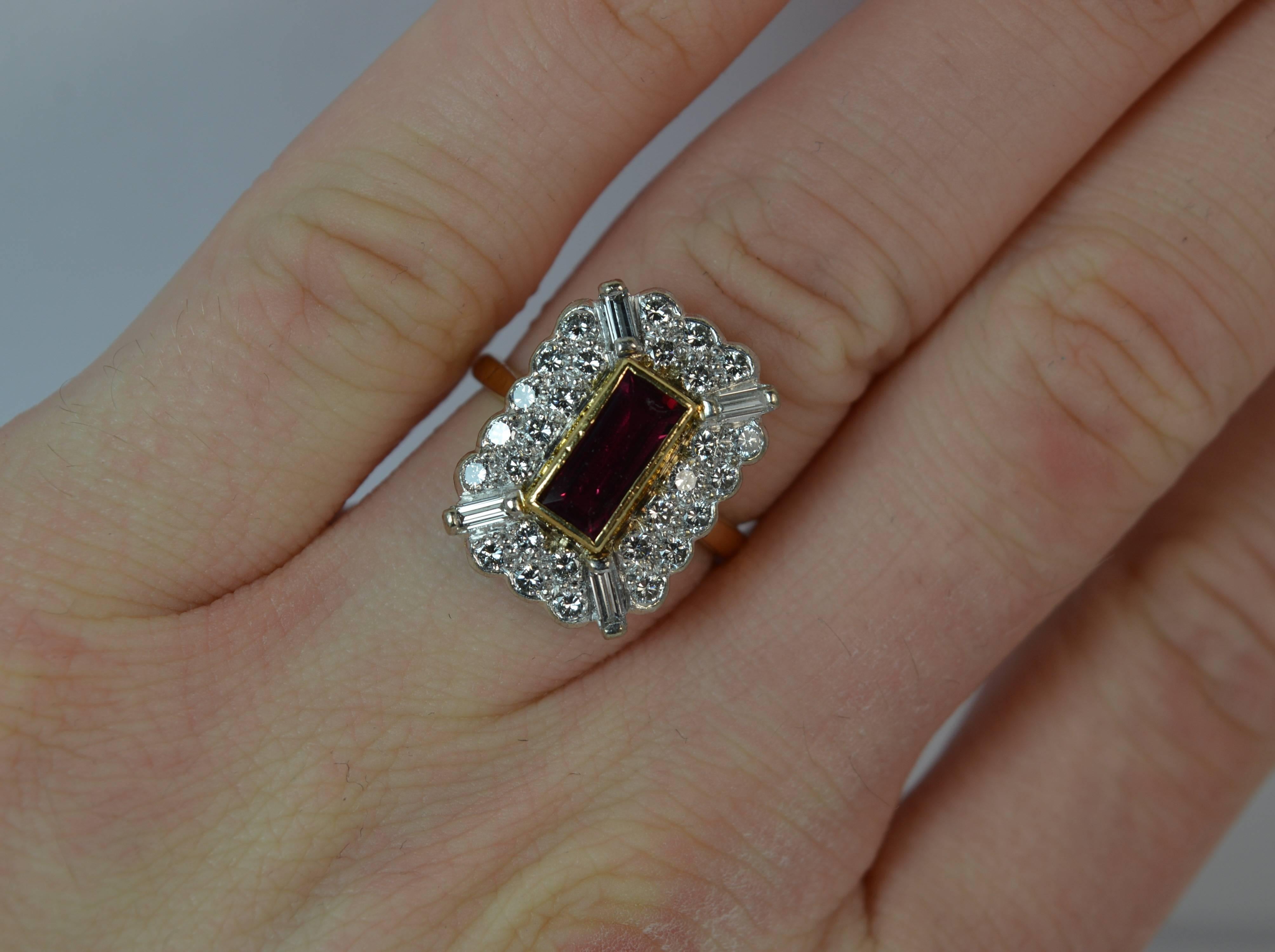 
A natural Ruby and Diamond cluster ring. A modern ring of art deco influence to the design.

Solid 18 carat yellow gold shank and swhite gold etting.

​The panel head cluster measures 13mm x 18mm approx and protrudes just 5mm off the finger.

It is