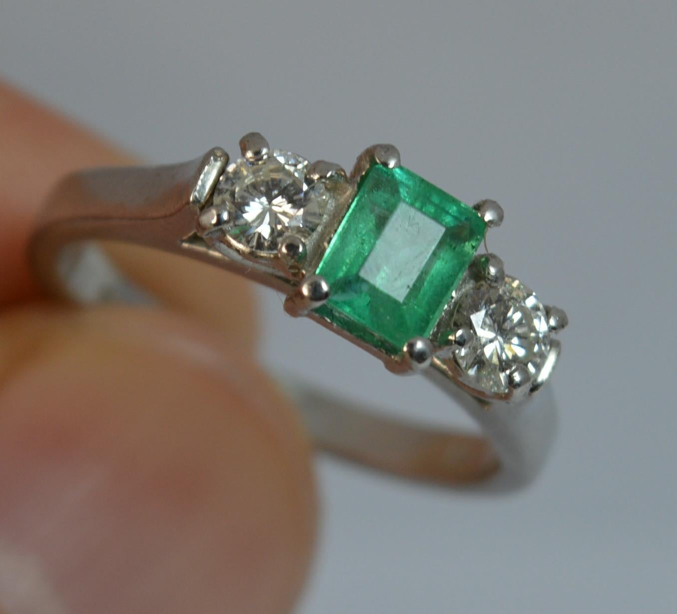 Emerald Cut Platinum Emerald and Diamond Trilogy Engagement Ring