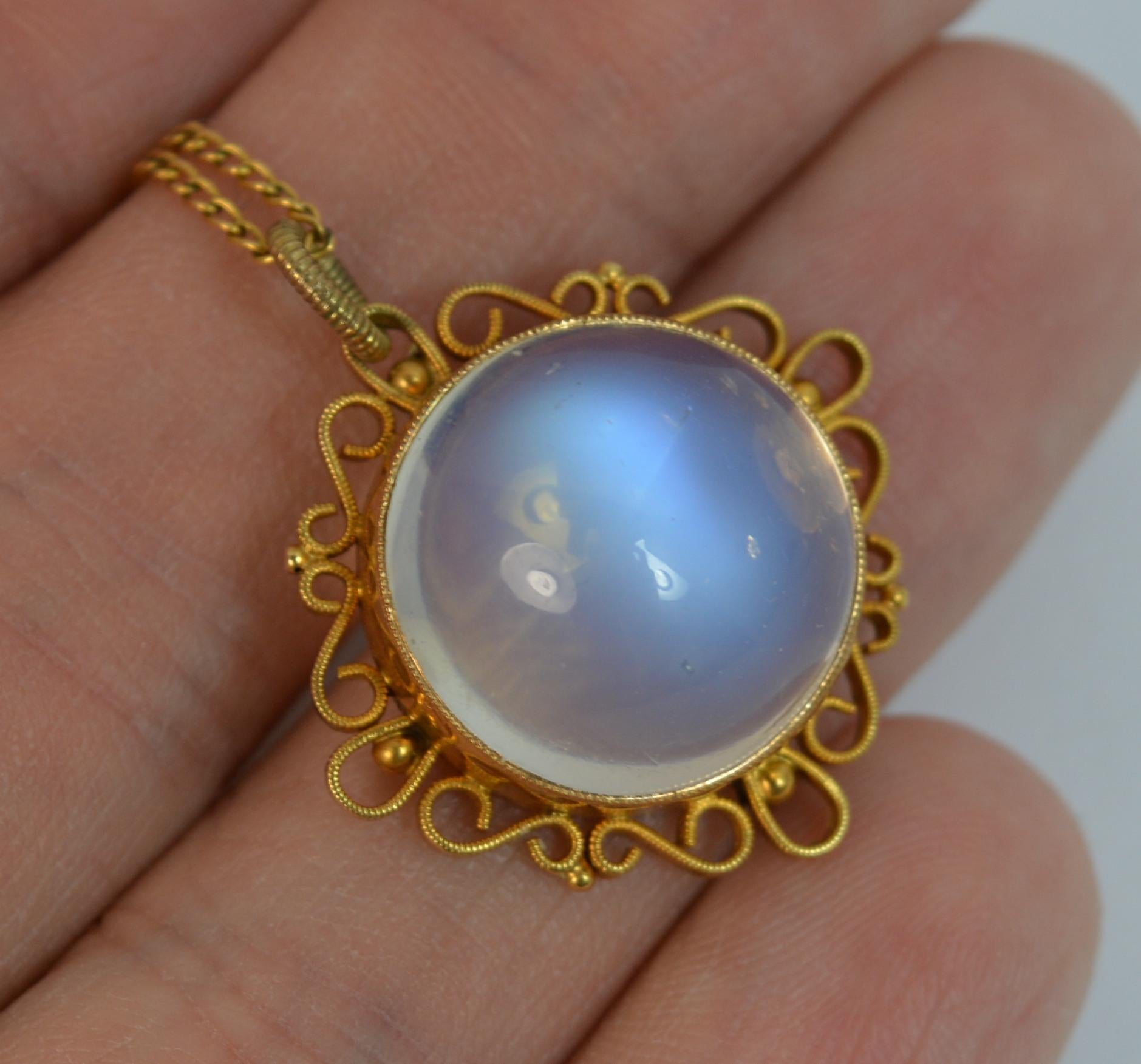 
A stunning late Victorian turn of the century pendant.

Solid 9 carat gold example set with a single large moonstone.

A fantastic filigree like gold chasing border.


CONDITION ; Very good. Well set stone, natural inclusions, natural non uniform