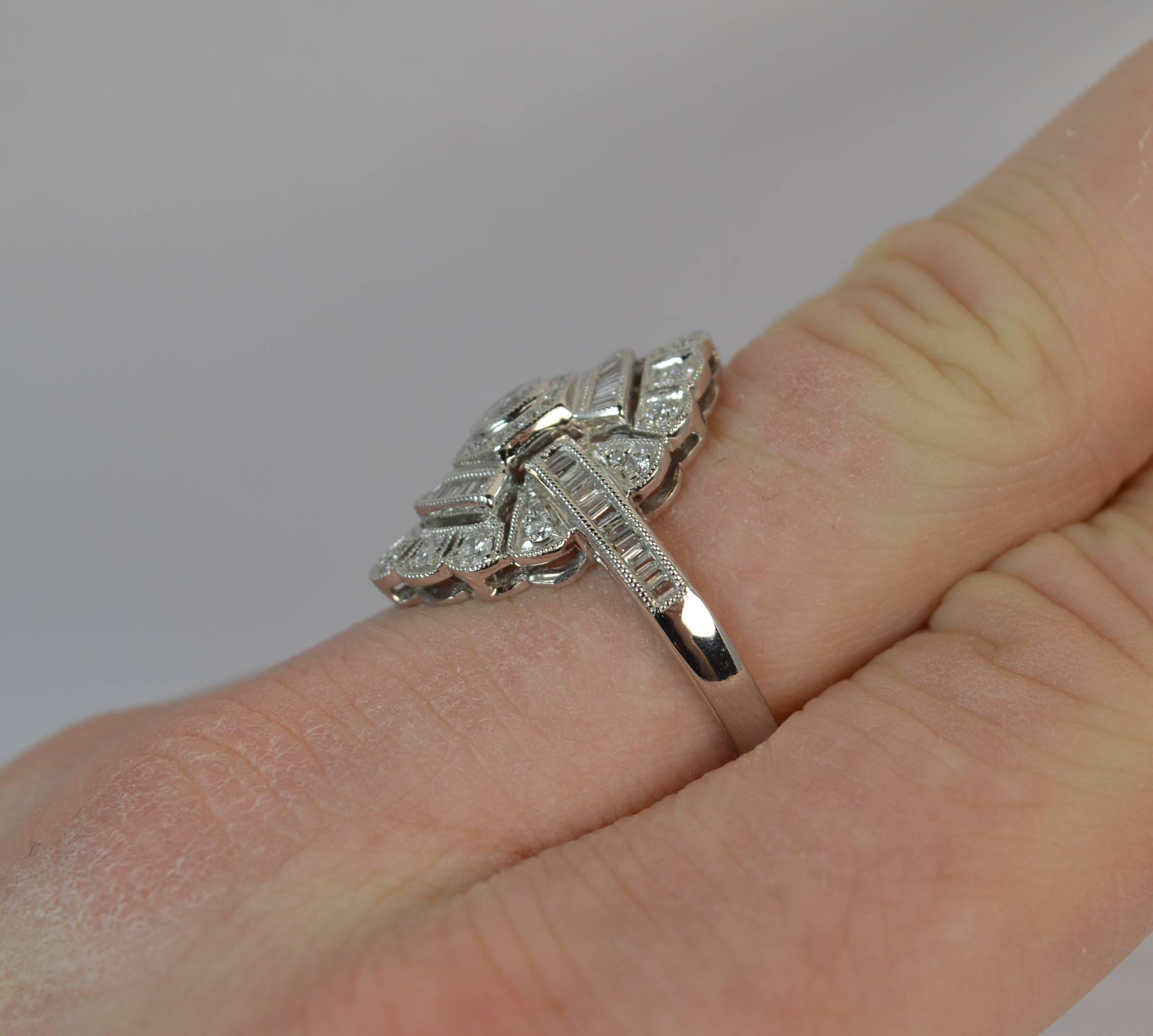 
A stunning Edwardian period design modern ring.

Solid 18 carat white gold ring.

​Designed with beautiful natural diamonds set throughout, very clean, bright and sparkly. An oval set diamond to the centre with baguette cut to each side and above
