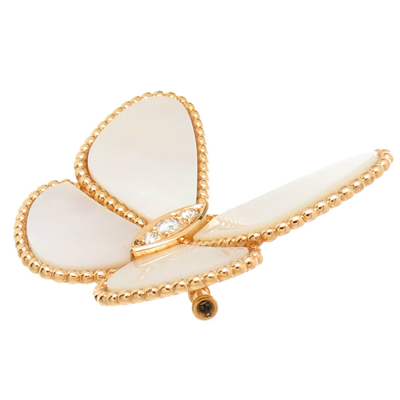 Van Cleef and Arpels 18K Yellow Gold, Diamonds and Mother of Pearl Wings Clip Brooch. Measuring 1 5/8 inch in length and 1 1/2 inch in Height. Signed and Numbered. Can be modified to also wear as a pendant.