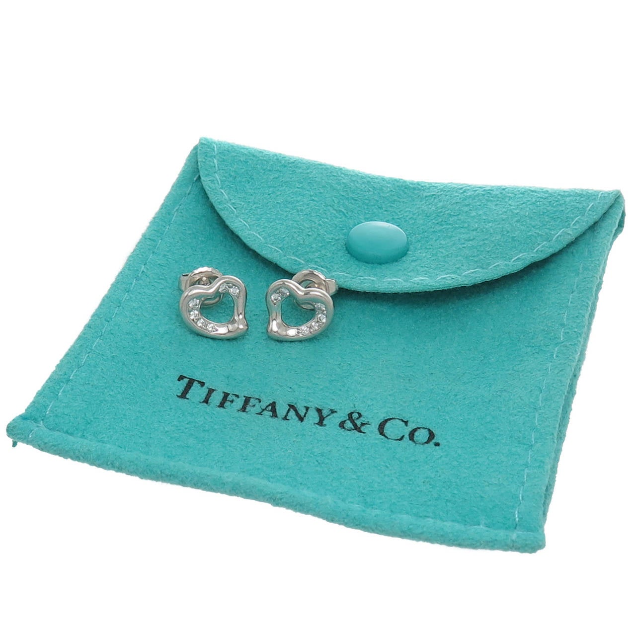 Elsa Peretti for Tiffany & Company, Platinum and Diamond, Opean Heart Earrings. Measuring 5/16 inch in diameter. Original Gift Pouch.