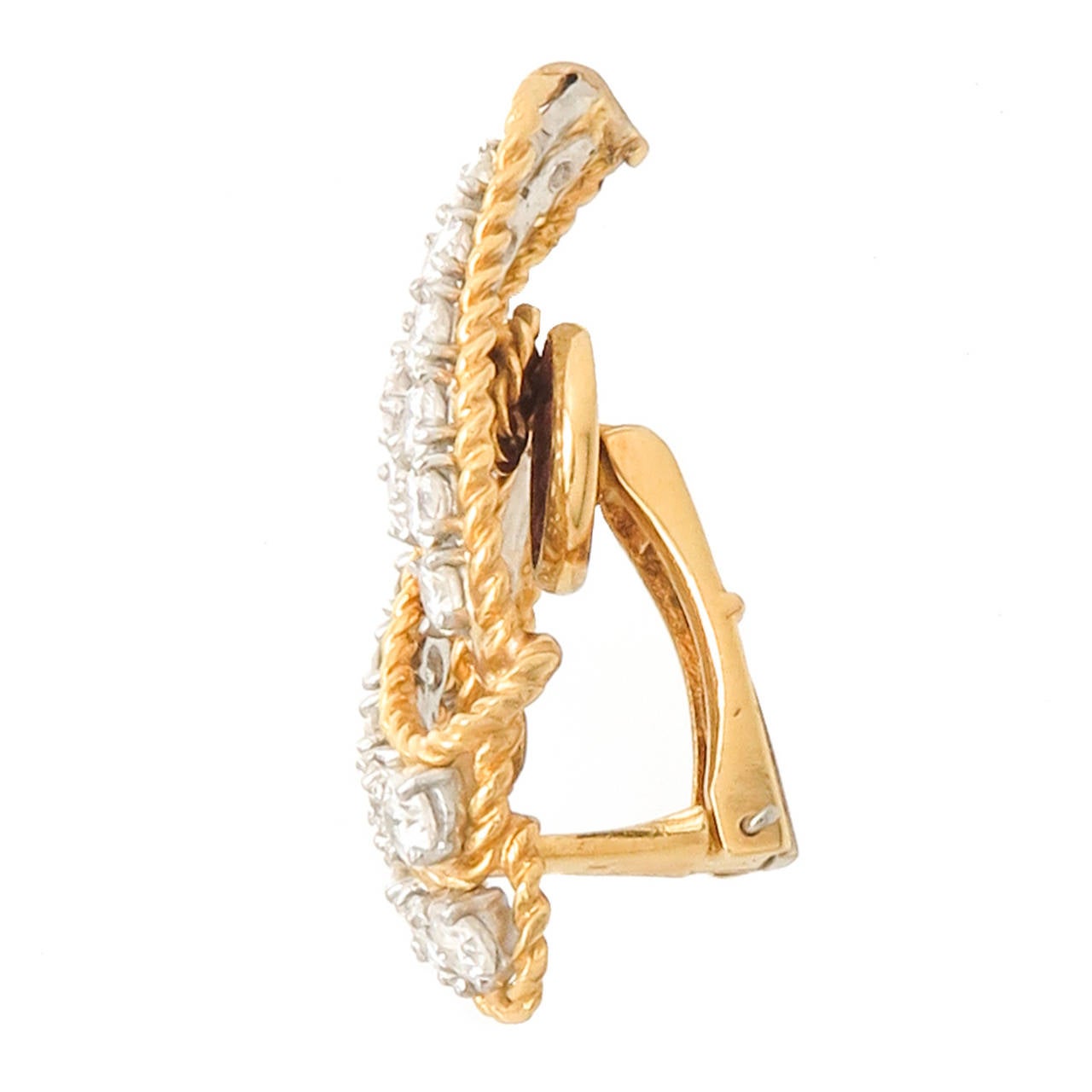 Superb 18 Karat Yellow Gold and Diamond Ear Clips by Pierre Sterle, Paris, a twist rope design surrounds 2 rows of round, very fine brilliant cut Diamonds totaling 6 carats. Clip backs to which posts can be easily added. Measuring 1 1/2 inch in