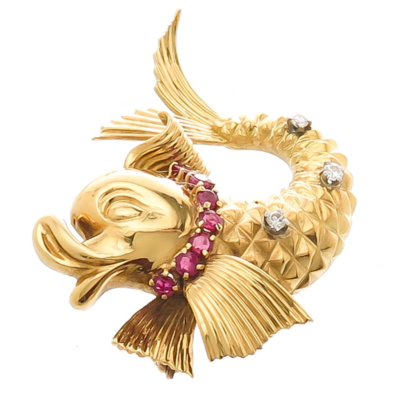 Circa 1960s 18k Yellow Gold  fish brooch by Tiffany and Company, nicely detailed and set with Diamonds and Rubies.