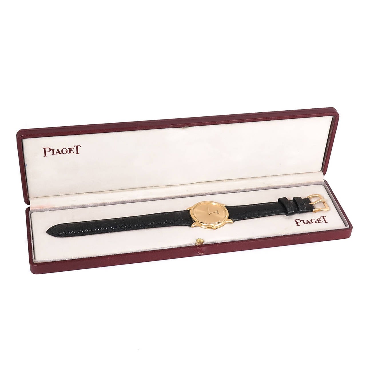 Circa 1990s Piaget 18K Yellow Gold 31 M.M. Wrist Watch, Quartz Movement, Gold dial. New black lizard strap. Original presentation box. Recently cleaned, timed and overhauled.